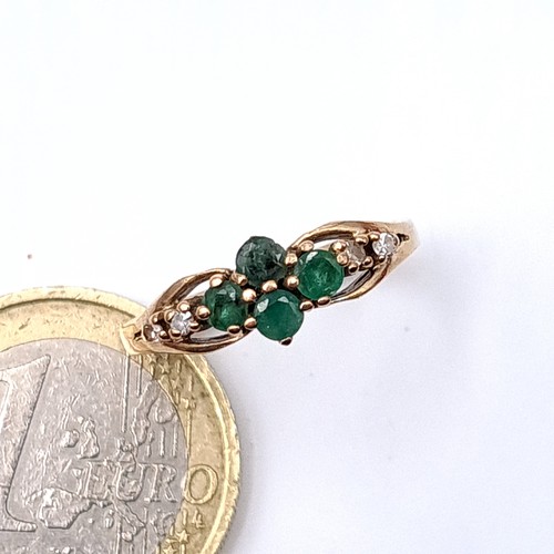 15 - Star Lot : A nine carat gold (375) emerald and diamond set ring. Ring size - N. Weight - 2.1 grams. ... 