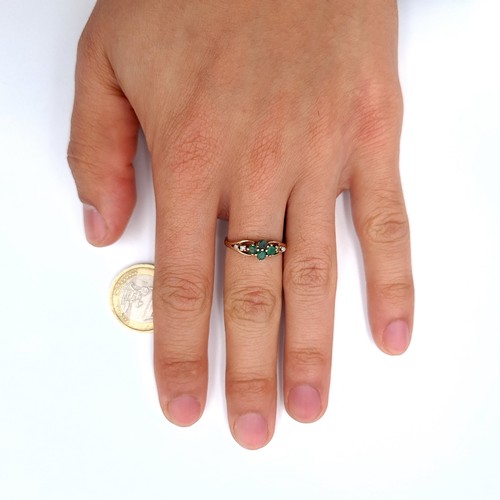 15 - Star Lot : A nine carat gold (375) emerald and diamond set ring. Ring size - N. Weight - 2.1 grams. ... 