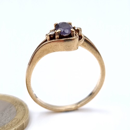 19 - Star Lot : A nine carat gold (375) blue sapphire and diamond  ring with gemstone twist mount. Ring s... 