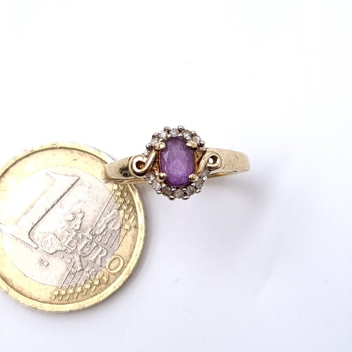 20 - Star Lot : A pretty amethyst and Diamond ring set in nine carat gold (375) with gemstone surround. R... 