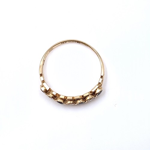 21 - A seven stone gem set half eternity ring set in nine carat gold. Ring size - O. Weight - 1.73 grams.... 