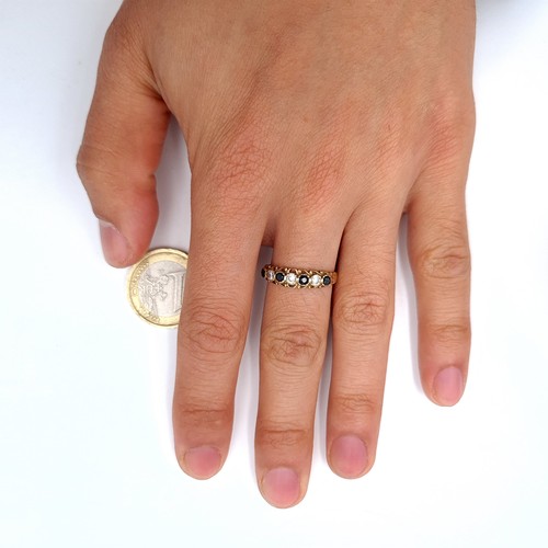 21 - A seven stone gem set half eternity ring set in nine carat gold. Ring size - O. Weight - 1.73 grams.... 