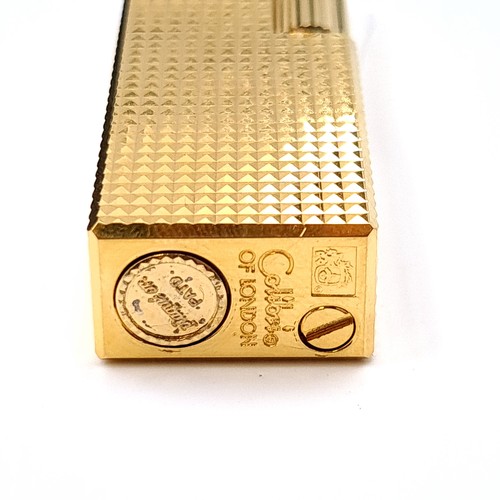 29 - A calibre gold metal engine turned lighter in original calibri presentation box.