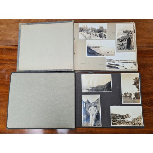 143 - Two fabulous early 20th century c. 1920s filled photo albums with brief inscriptions of names and pl... 