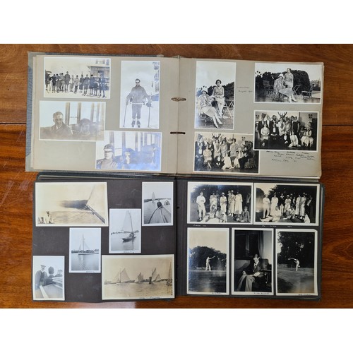 143 - Two fabulous early 20th century c. 1920s filled photo albums with brief inscriptions of names and pl... 