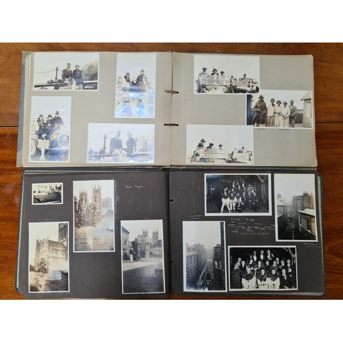 143 - Two fabulous early 20th century c. 1920s filled photo albums with brief inscriptions of names and pl... 