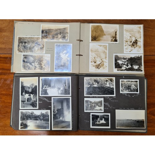 143 - Two fabulous early 20th century c. 1920s filled photo albums with brief inscriptions of names and pl... 