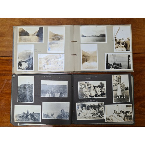 143 - Two fabulous early 20th century c. 1920s filled photo albums with brief inscriptions of names and pl... 