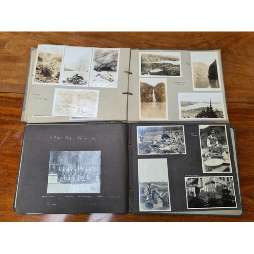 143 - Two fabulous early 20th century c. 1920s filled photo albums with brief inscriptions of names and pl... 