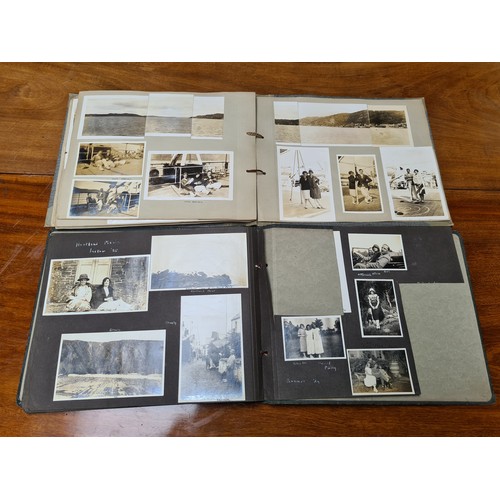 143 - Two fabulous early 20th century c. 1920s filled photo albums with brief inscriptions of names and pl... 