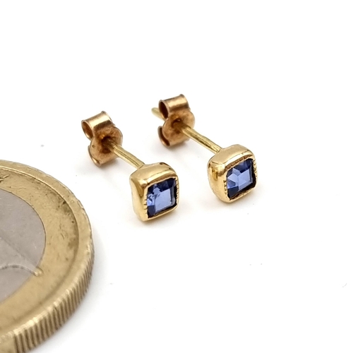 18 - A pair of nine carat gold sapphire stud earrings. Total weight - 0.74 grams.