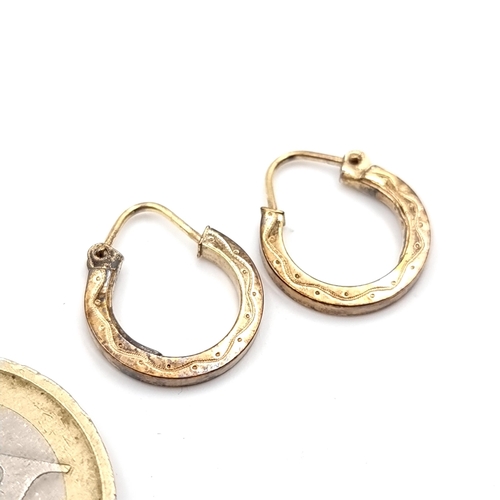 23 - A pair of vintage nine carat gold hoop earrings. Suitable for pierced ears. Total weight - 1.11 gram... 