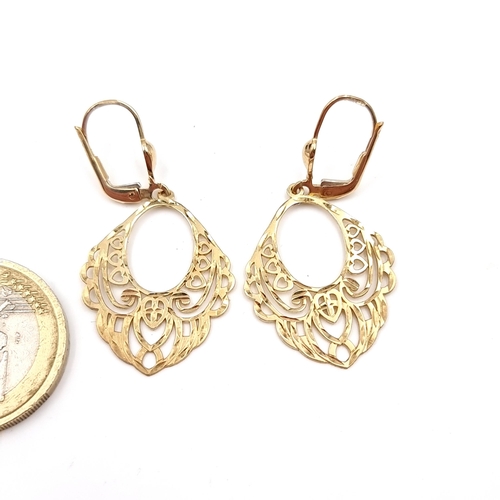 32 - A pair of nine carat gold filigree designed earrings - suitable for pierced ears. Total weight - 2.6... 