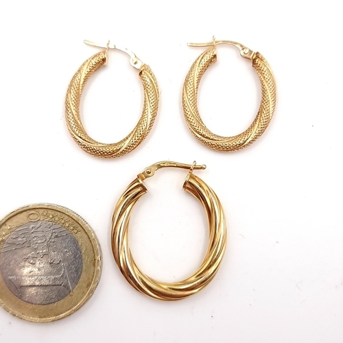 33 - A pair of 9ct gold hoop earrings - suitable for pierced ears. Weight - 1.11 grams. Together with a s... 