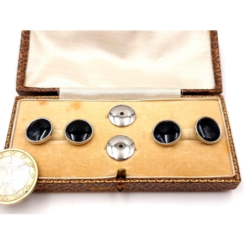 36 - A set of cuff-links together with collar studs. Boxed.