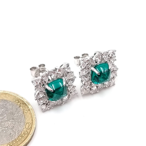 41 - A pair of Lab created Emerald set stud silver earrings. Weight - 6.4 grams. Stones cold to the touch... 