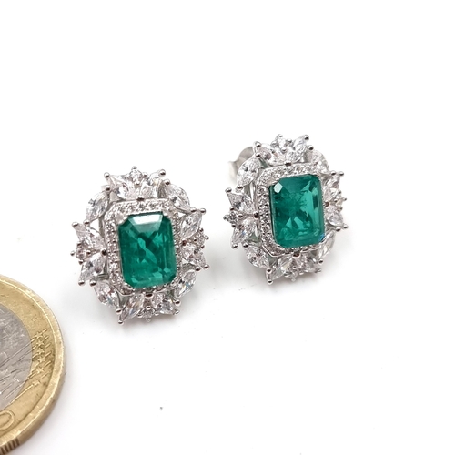 44 - A pair of beautiful Lab created columbian Emerald facet cut stone earrings set in sterling silver wi... 