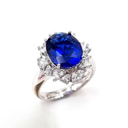 47 - A stunning lab created huge Sapphire and gem set statement ring with gemstone surround. Ring size - ... 