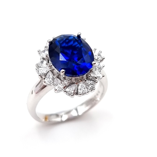 48 - A stunning lab created huge Sapphire and gem set statement ring with gemstone surround. Ring size - ... 