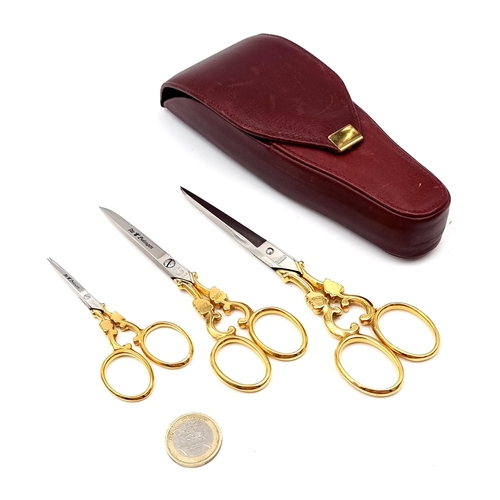 5 - A set of three celebratory gold metal scissors dated 1882-1992 marked by maker - Solingen. Lengths -... 