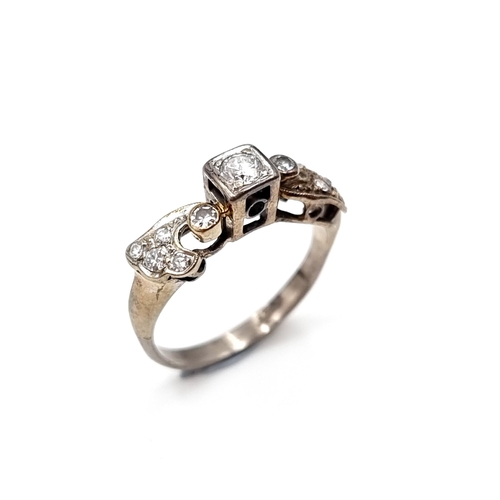 9 - Star Lot : A very attractive antique art deco nine carat white gold ring set with central diamond to... 