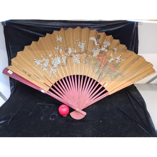 137 - A large vintage Chinese hand painted fan featuring gouache and watercolour imagery of birds and flor... 