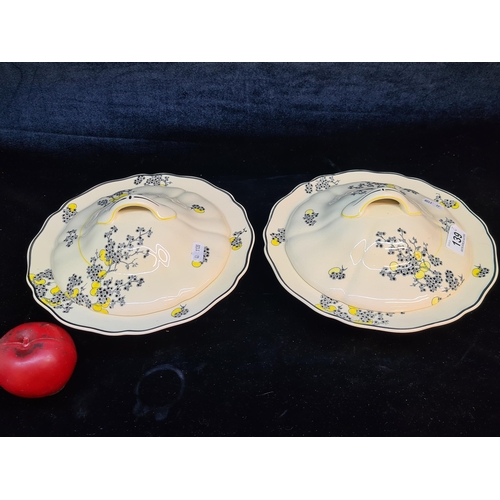 139 - A pair of sweet 1930s Royal Doulton porcelain lidded vegetable terrines in the 'Carnival' pattern wi... 