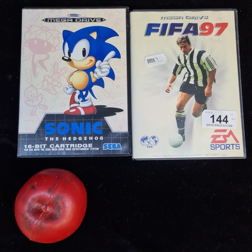 144 - Two nostalgic Sega Mega Drive console cartridge games of Sonic the hedgehog and EA Sports Fifa 97.