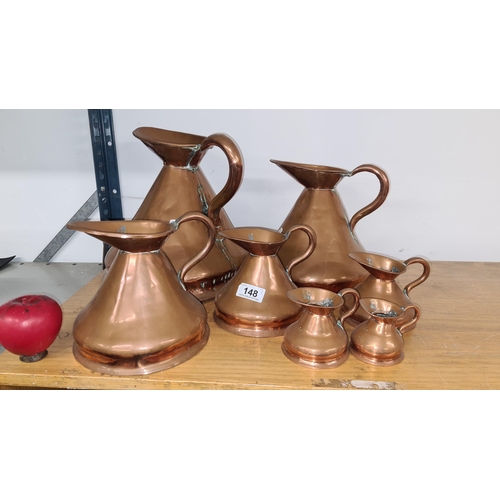 148 - Seven Victorian graduated copper Imperial measuring jugs with lead stamps. Six of these are selling ... 