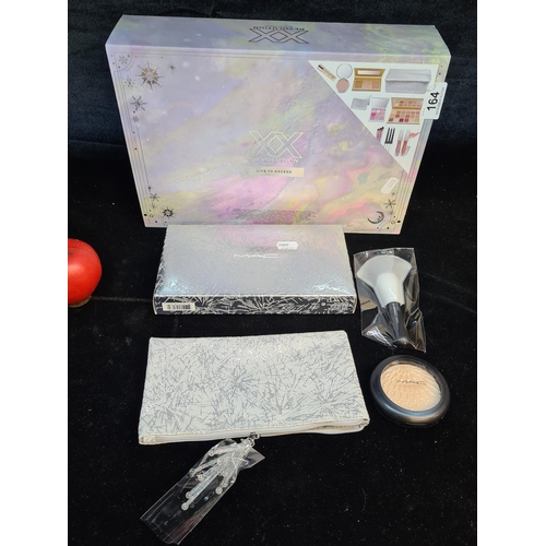 164 - Two fab ladies makeup gift sets including a MAC Firelit Kit of a highlighter in the shade Champagne,... 