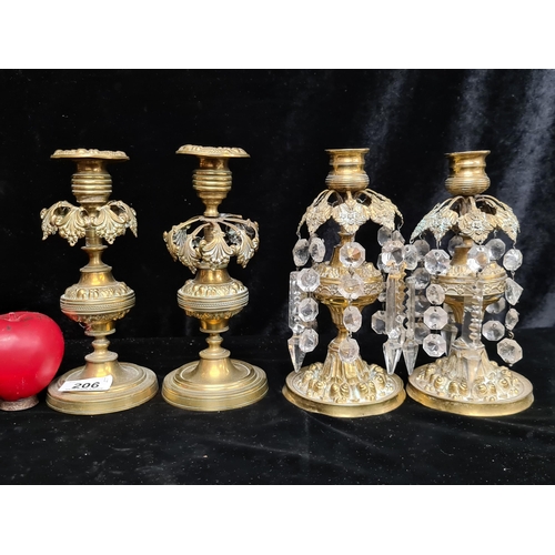 206 - Four vintage brass candlestick holders two of which feature beautiful decorative faceted pendants. A... 