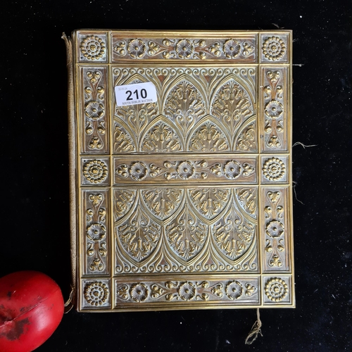 210 - A strikingly pretty antique brass embossed folio with green satin lining to interior with a beautifu... 