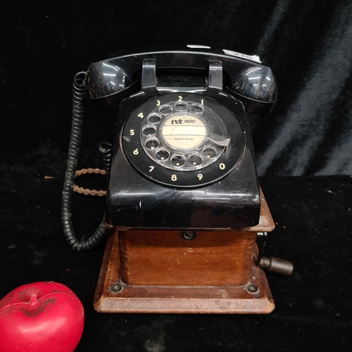 215 - A super handsome Irish made Northern Telecom rotary telephone attached to wooden hand crank bell box... 