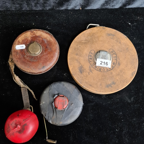 216 - Three vintage measuring tapes including one made in West Germany and one Constantia made in England.