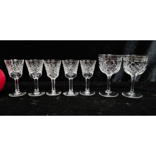 217 - Five Waterford Crystal sherry glasses with acid marks to base, along with two delicately cut larger ... 