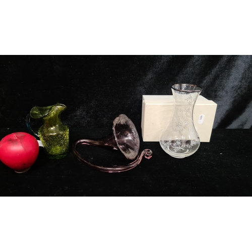 226 - Three pieces of studio art glass including a clear etched example, along with a ruby example in the ... 