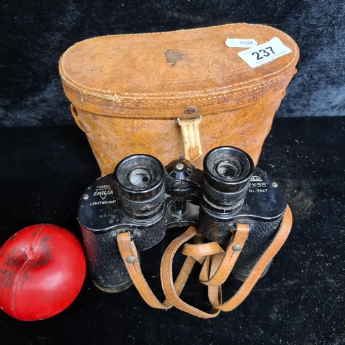 237 - A fantastic pair of Japanese coated Emilia lightweight binoculars. 7 x 35 No. 7647. In original leat... 