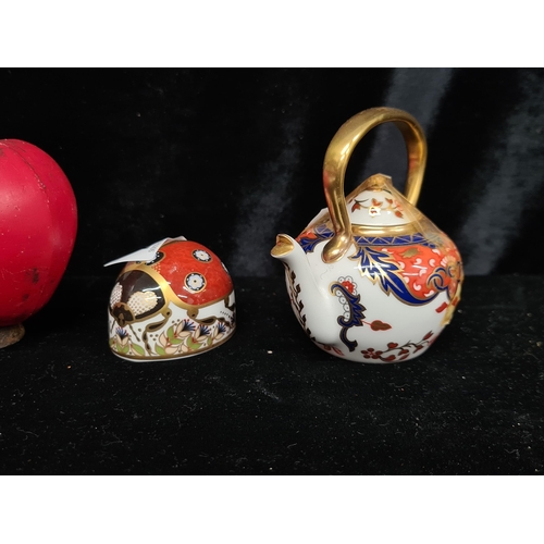 244 - Two Royal Crown Derby fine bone China paperweights in the forms of a teapot and a ladybird. Very swe... 