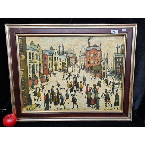 67 - A mid century Large  'L.S Lowry' print on board titled 'Village Square'. Housed in a wooden gilt fra... 