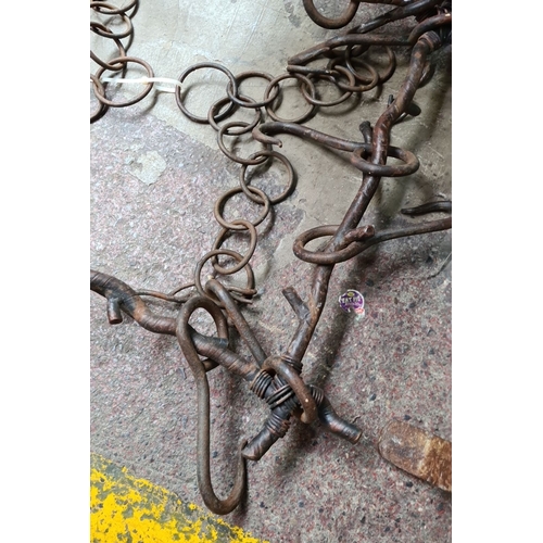 480 - A fantastic antique hand forged wrought iron hanging pot rack with hooks in the form of twisted bran... 