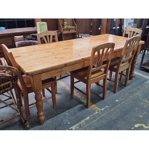 484 - Star lot : A Solid pine long farmhouse dining table with turned legs, accompanied with five matching... 