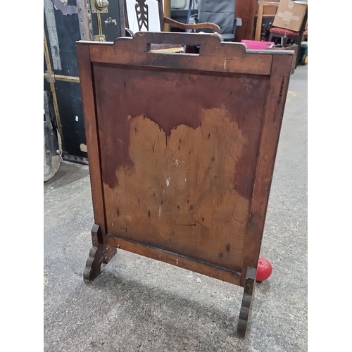 500 - An antique handsome wooden  fire screen with paneled front, possibly from the Victorian era, featuri... 