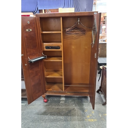 638 - Star Lot: A beautiful Compactom wooden wardrobe with double doors, internal shelving, and hanging sp... 