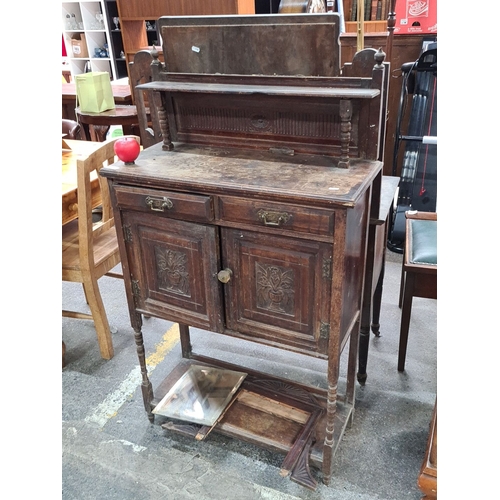 639 - Antique Victorian mahogany sideboard with carved floral panels, spindle supports, and storage compar... 