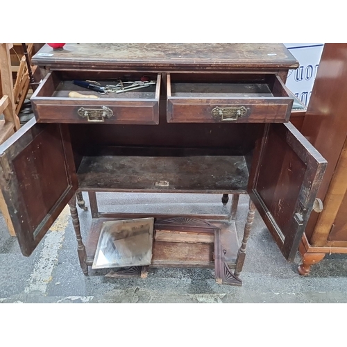 639 - Antique Victorian mahogany sideboard with carved floral panels, spindle supports, and storage compar... 