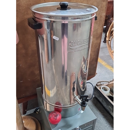 643 - Cygnet stainless steel hot water urn. Electric-powered, featuring a spout for dispensing. 