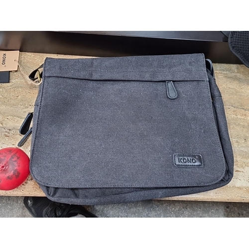 659 - A brand new KONO black canvas messenger bag with adjustable strap and multiple interior compartments... 