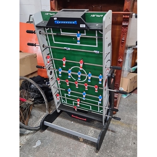 665 - Riley VR-90 folding foosball table, featuring a green playing surface with red and blue teams. Sturd... 