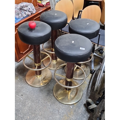 667 - Star Lot: A great set of four vintage Johanson Design Made in Sweden bar stools with black leather c... 