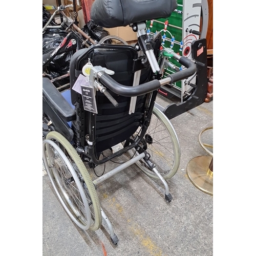 668 - A Rehab classic balance wheelchair with manual features and ergonomic design. Adjustable headrest, p... 